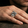 Load image into Gallery viewer, Polished silver Japanese Oni ring on the finger, wearable shot emphasizing sharp carving, horns, and bold statement profile
