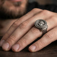 Load image into Gallery viewer, Oxidized Greek coin ring worn on a finger, lifestyle close-up showing the warrior profile relief and rope-edge frame
