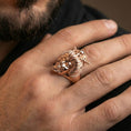 Load image into Gallery viewer, Rose gold plated geisha skull ring on the finger, lifestyle shot showcasing the dramatic Japanese-inspired headpiece and skull face motif
