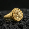 Load image into Gallery viewer, Gold plated ancient coin signet ring with detailed bearded king profile engraving, product-only macro on black volcanic rock
