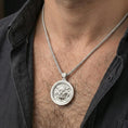 Load image into Gallery viewer, Polished silver guardian lion medallion necklace worn on neck, clean lifestyle framing, reflective metal and crisp details
