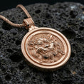 Load image into Gallery viewer, Rose gold plated guardian lion medallion pendant on volcanic rock, textured lava stone background, high-detail facial relief
