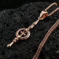 Load image into Gallery viewer, Rose gold plated ankh spear pendant on volcanic rock, textured lava stone background, high-detail ankh emblem
