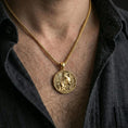Load image into Gallery viewer, Gold plated winged Pegasus medallion necklace worn on neck, premium styling, myth-inspired pendant as focal point
