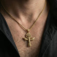 Load image into Gallery viewer, Gold plated winged ankh cross pendant necklace worn on neck, premium styling, Egyptian talisman as focal point
