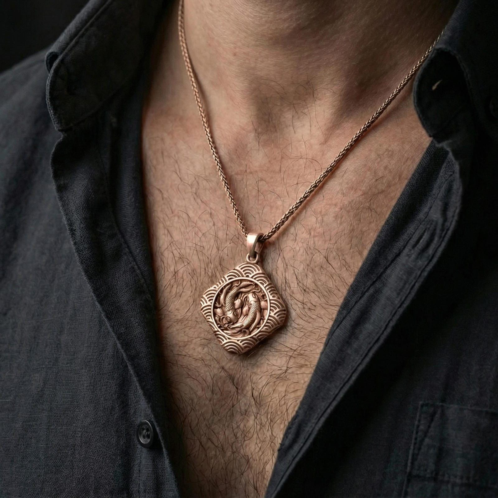 Rose gold plated koi fish necklace worn on neck, lifestyle wear shot, warm plating tone and sculpted koi details
