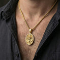 Load image into Gallery viewer, Gold plated Hela pendant necklace worn on neck, premium styling, Norse mythology medallion as focal point
