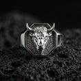 Load image into Gallery viewer, Polished silver bull head signet ring on volcanic rock, crisp sculpted muzzle and clean geometric bezel, close-up lighting
