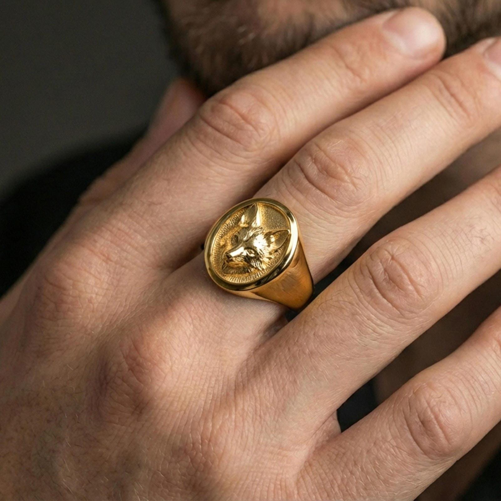 Gold plated fox head signet ring worn on finger, premium styling, statement animal ring as focal point on hand