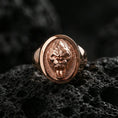 Load image into Gallery viewer, Rose gold plated gorilla head signet ring on volcanic rock, textured lava stone background, detailed roar expression engraving
