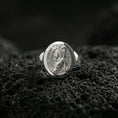 Load image into Gallery viewer, Polished silver tiger signet ring on volcanic rock, crisp stripe carving and clean oval bezel edge, close-up lighting
