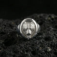 Load image into Gallery viewer, Polished silver bear signet ring on volcanic rock, crisp facial contours and smooth oval bezel edge, close-up lighting
