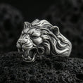 Load image into Gallery viewer, Oxidized sterling silver angry lion king ring on volcanic rock, roaring lion head with sculpted mane, macro studio close-up
