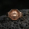 Load image into Gallery viewer, Rose gold plated wolf signet ring on volcanic rock, octagon wolf head emblem ring with defined muzzle and layered fur details, luxury macro
