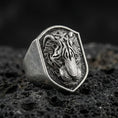 Load image into Gallery viewer, Oxidized sterling silver tiger signet ring on volcanic rock, shield-shaped face with raised tiger head relief and dark textured background, macro jewelry photo

