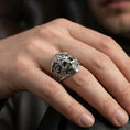 Load image into Gallery viewer, Oxidized Masonic skull ring worn on a finger, close-up lifestyle photo highlighting the compass-and-G emblem
