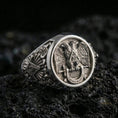 Load image into Gallery viewer, Sterling silver Masonic ring in a polished silver finish, high-relief double-headed eagle crest with ornate side engraving, close-up on volcanic stone
