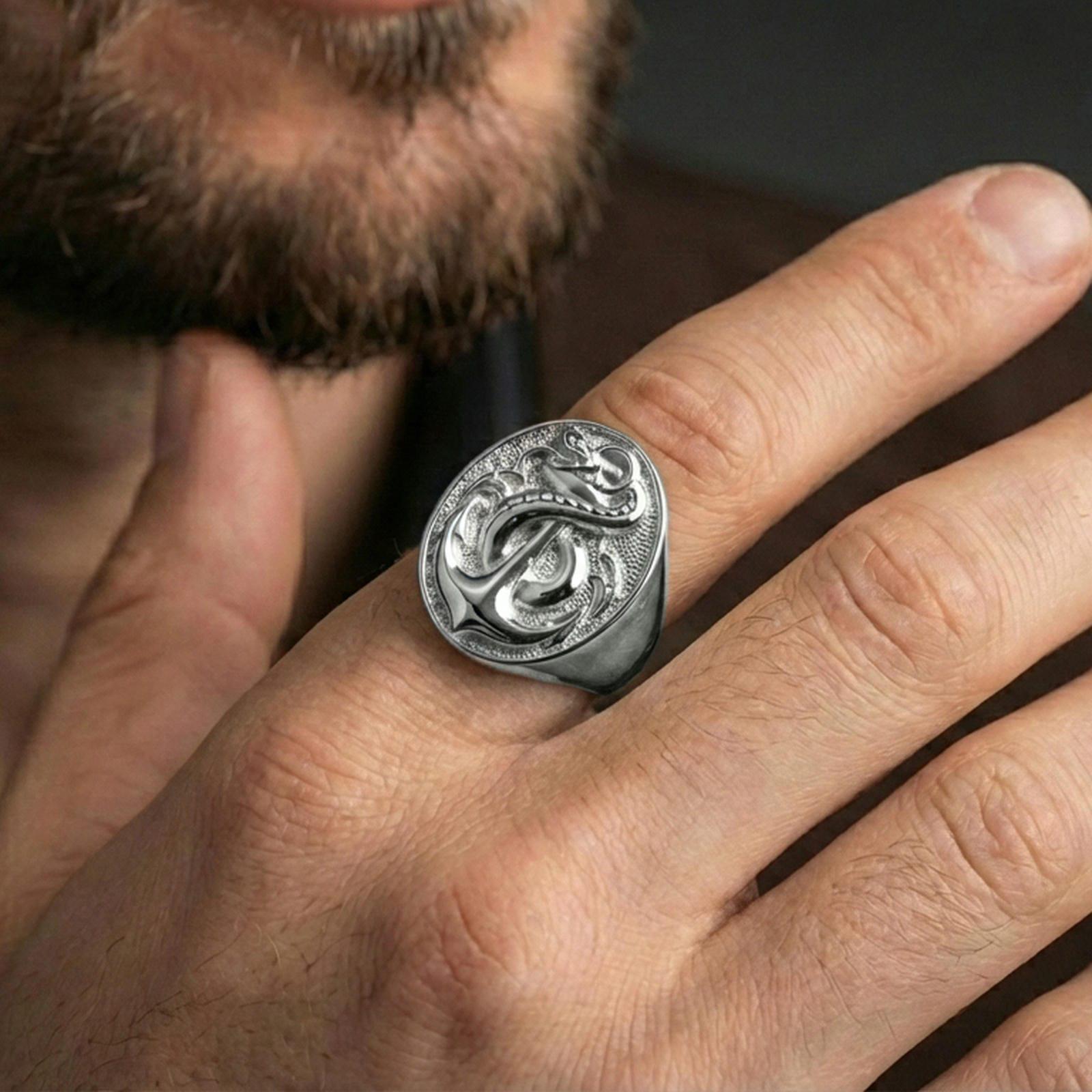 Polished silver finish anchor and snake signet ring on the finger, macro lifestyle image showing crisp anchor lines and coiled serpent detail