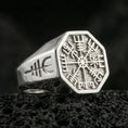 Load image into Gallery viewer, Sterling silver Vegvisir signet ring in a polished silver finish, Norse runic compass symbol on an octagon signet, close-up on volcanic stone
