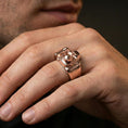 Load image into Gallery viewer, Rose gold plated finish camera ring on a finger, macro lifestyle shot showcasing the 3D camera design and smooth band profile
