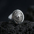 Load image into Gallery viewer, 925 sterling silver lion head signet ring on volcanic stone, polished silver finish with crisp round face and textured background
