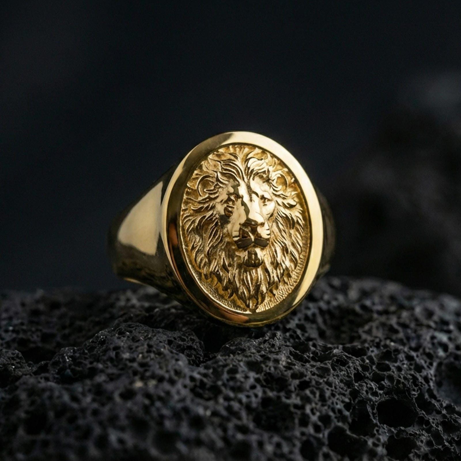 925 sterling silver lion head signet ring on volcanic stone, gold plated finish with bold lion portrait engraving