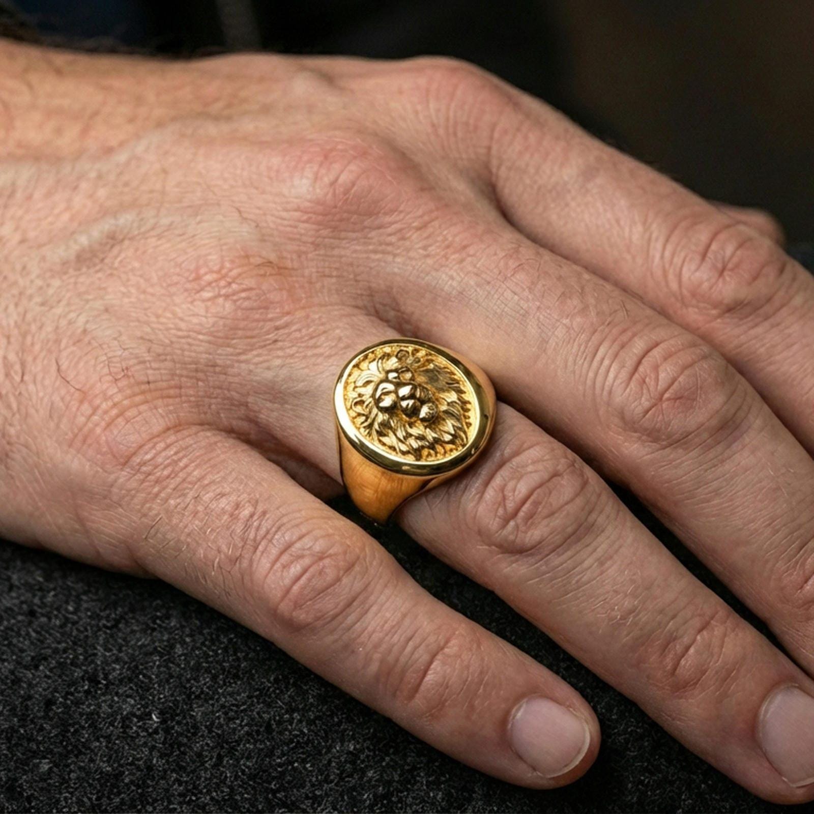 925 sterling silver lion head signet ring worn on a finger, gold plated finish with sharp lion face details and premium shine
