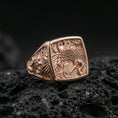 Load image into Gallery viewer, 925 sterling silver crane signet ring on volcanic stone, rose gold plated finish with warm tone enhancing the crane, feathers, and decorative pattern
