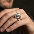Load image into Gallery viewer, Polished silver bull ring on finger, natural hand pose highlighting the realistic animal head sculpt and solid band shape
