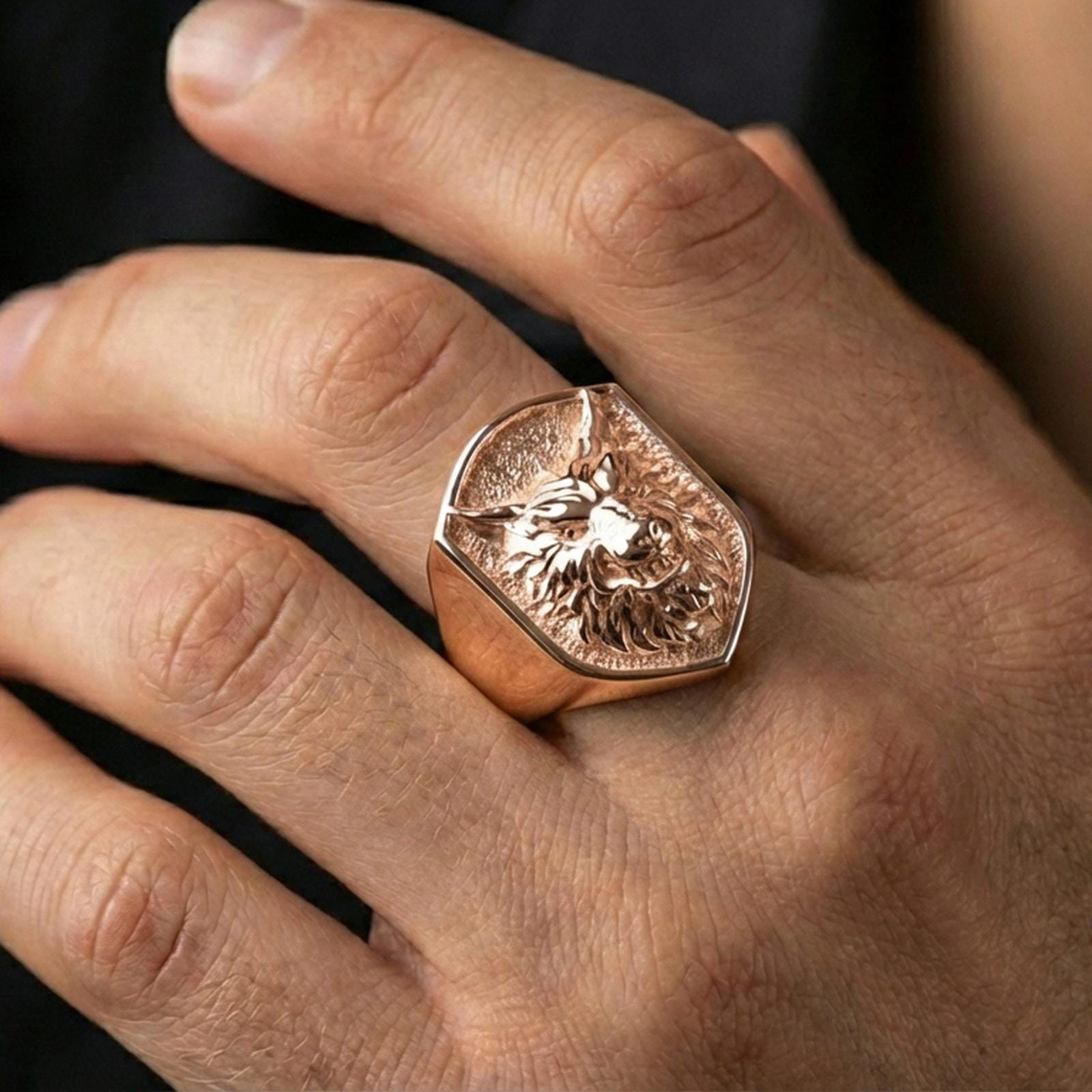 Rose Gold plated wolf signet ring worn on finger, bold animal jewelry look for men