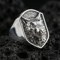 Load image into Gallery viewer, Polished silver wolf head ring on volcanic stone, sharp snarl design with premium studio lighting
