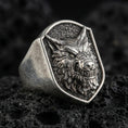 Load image into Gallery viewer, Oxidized sterling silver angry wolf head signet ring on volcanic rock, high detail macro closeup
