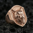 Load image into Gallery viewer, Rose gold plated angry wolf ring on volcanic rock, aggressive wolf face signet ring detail
