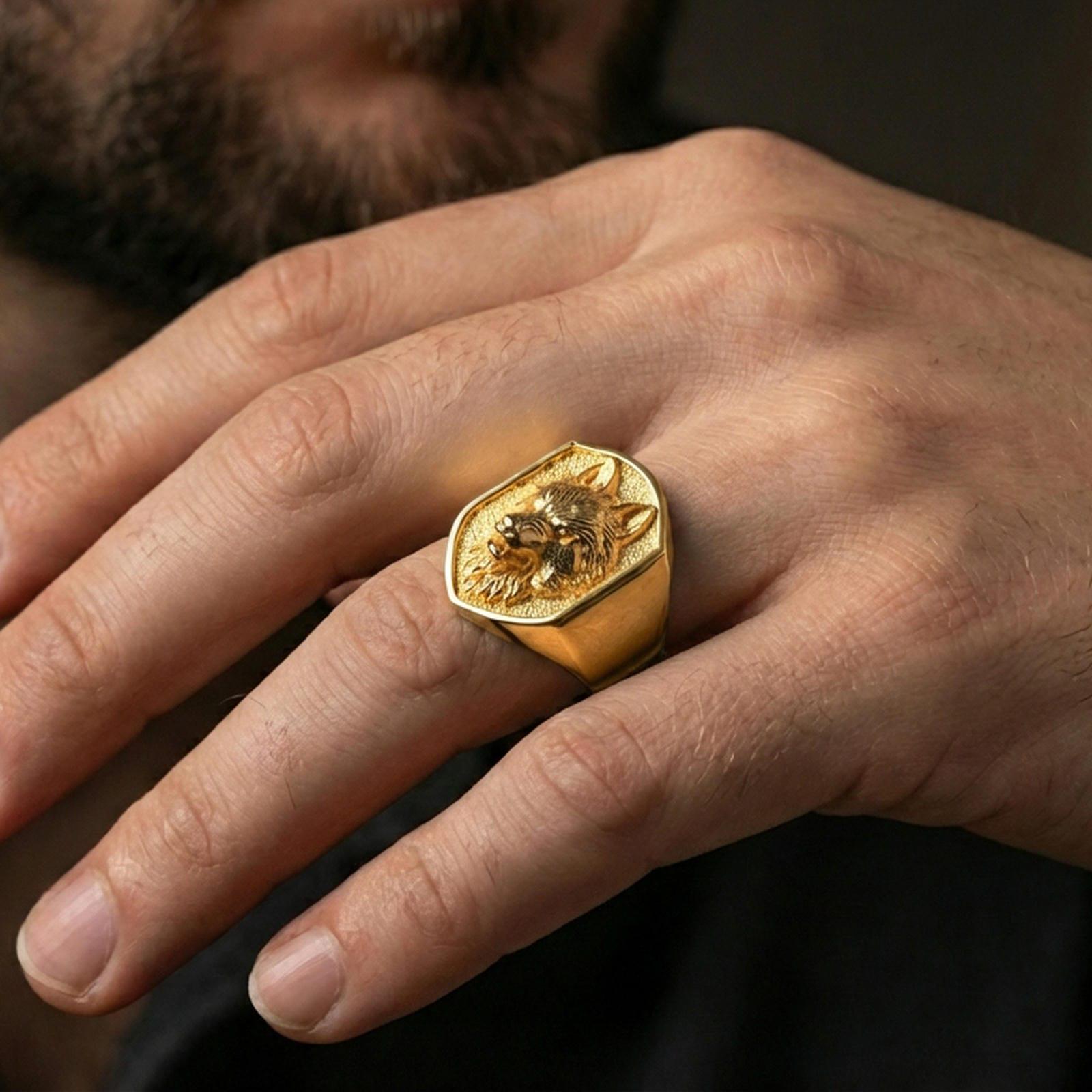 Gold plated wolf signet ring worn on finger, strong alpha wolf jewelry aesthetic