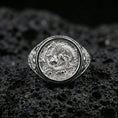 Load image into Gallery viewer, Polished silver koi fish ring on volcanic rock surface, close-up highlighting the round bezel and crisp engraved wave pattern
