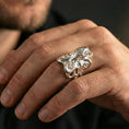 Load image into Gallery viewer, Polished silver octopus ring on finger, natural hand pose highlighting the detailed tentacle wrap and textured sea-creature finish
