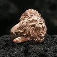 Load image into Gallery viewer, Rose gold plated lion head ring on volcanic rock, detailed mane and open mouth roaring expression

