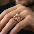 Load image into Gallery viewer, Rose gold plated elephant head ring on finger, close-up lifestyle photo showcasing the detailed ears, tusks, and wide signet silhouette
