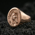 Load image into Gallery viewer, Rose gold plated horse head ring on volcanic rock, sharp macro product photo showcasing the round face, detailed bridle engraving, and clean signet silhouette
