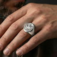 Load image into Gallery viewer, Polished silver wolf ring on hand, clean modern statement fit with sharp wolf profile detailing
