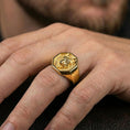 Load image into Gallery viewer, Gold plated fox signet ring worn on a finger with a dark minimal background, showing strong contrast and texture
