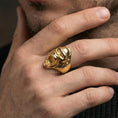 Load image into Gallery viewer, Gold plated gorilla ring worn on a finger with dark minimal background, highlighting the aggressive profile
