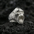 Load image into Gallery viewer, Polished silver gorilla ring photographed on textured volcanic rock with sharp focus and premium lighting
