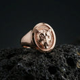Load image into Gallery viewer, Rose gold plated leopard head ring on volcanic rock, sharp macro product photo showcasing the detailed feline portrait and round signet top

