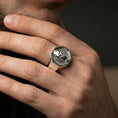 Load image into Gallery viewer, Polished silver gorilla signet ring on a hand, macro angle emphasizing the bold ring face and sculpted features

