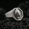 Load image into Gallery viewer, Polished silver gorilla signet ring displayed on textured volcanic rock with crisp macro focus and premium lighting
