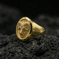 Load image into Gallery viewer, Gold plated ram signet ring on black volcanic rock, close-up emphasizing the horn texture and bold oval frame
