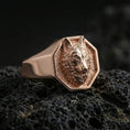 Load image into Gallery viewer, Rose gold plated wolf head signet ring on porous volcanic rock with controlled highlights and deep shadows
