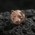 Load image into Gallery viewer, Rose gold plated tiger face ring on porous volcanic rock with controlled highlights and deep contrast
