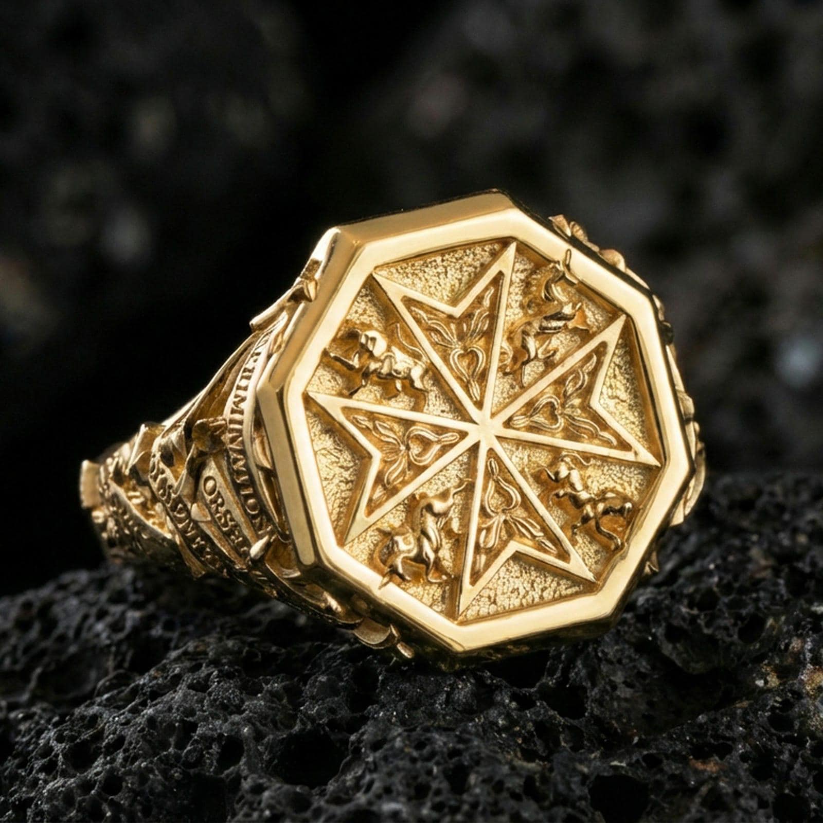 Sterling silver Crusader-inspired signet ring with a gold plated finish, octagonal Maltese cross face with decorative side engravings, macro product shot on volcanic rock
